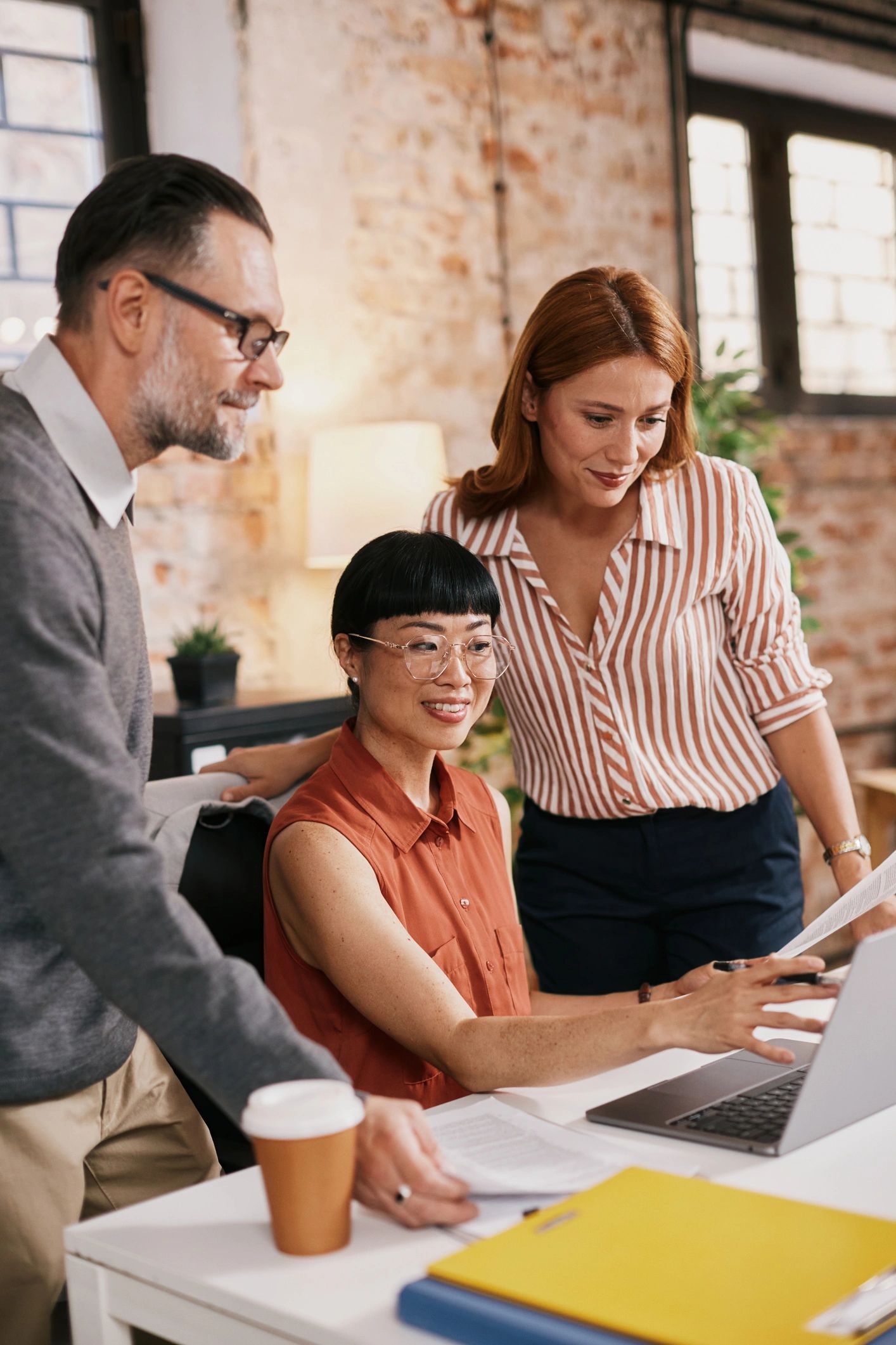 Professionals collaborating around a desk